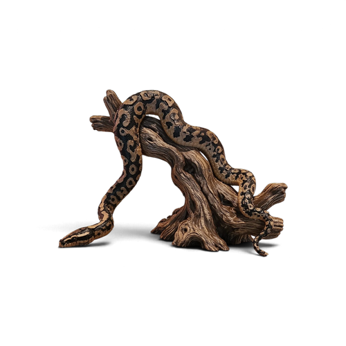 Tan and black patterned 3D-printed snake draped over a low wood-look branch stand
