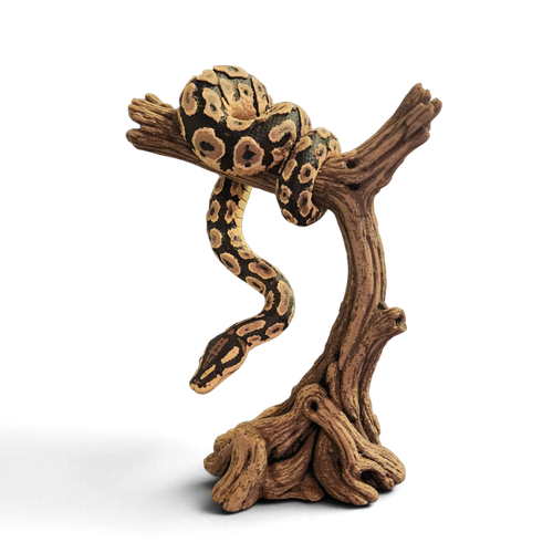 Tan and black patterned 3D-printed snake coiled over a tall wood-look branch stand