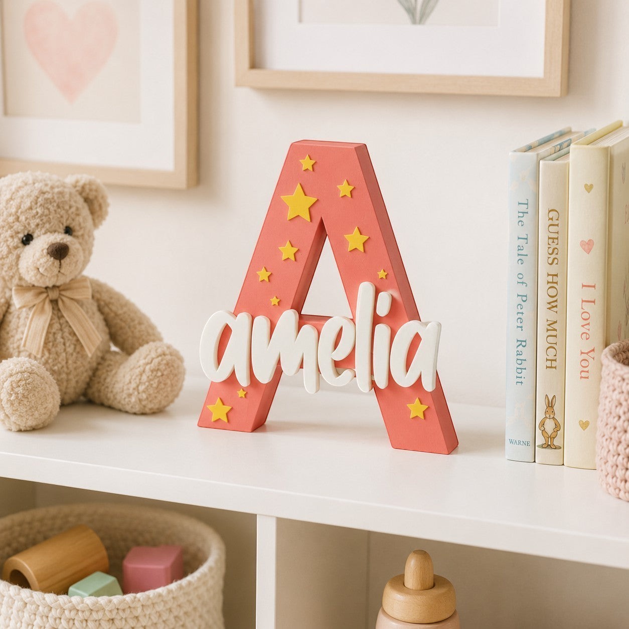 Stone Look Statues coral letter A nursery decor with white name Amelia and yellow star accents on a white shelf