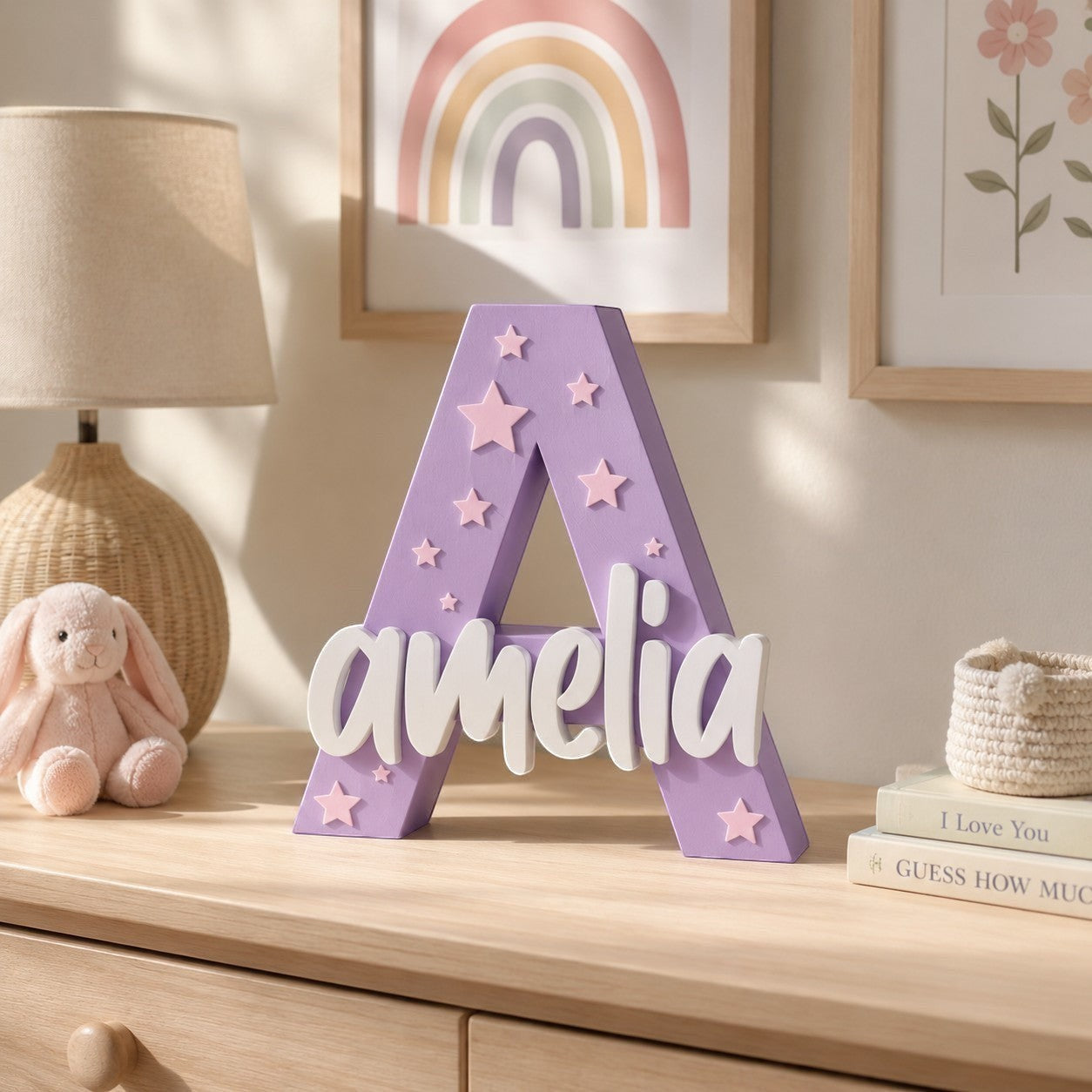 Stone Look Statues purple letter A nursery decor with white Amelia name and star accents on a wooden dresser.